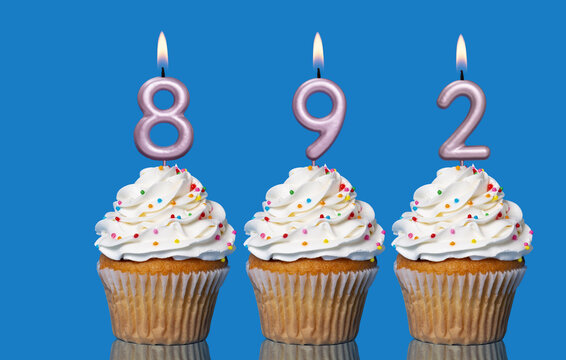 Birthday Cupcakes With Candles Lit Forming The Number 892