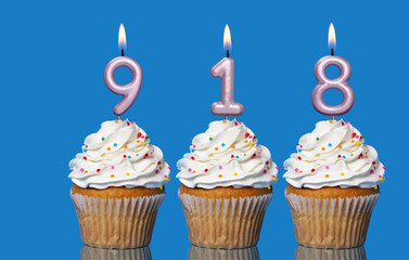 Birthday Cupcakes With Candles Lit Forming The Number 918