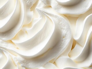 whipped cream texture with delicate peaks and valleys creating soft rippling waves of pure white dessert topping on dark background for food photography