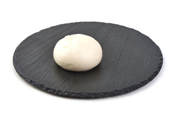 Mozzarella cheese, close-up, isolated on white background.
