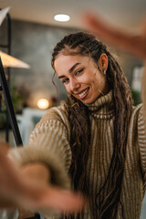 beautiful smiling young woman take a self portrait and pose at home