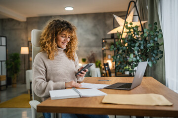 adult woman have contactless payment on mobile phone at home