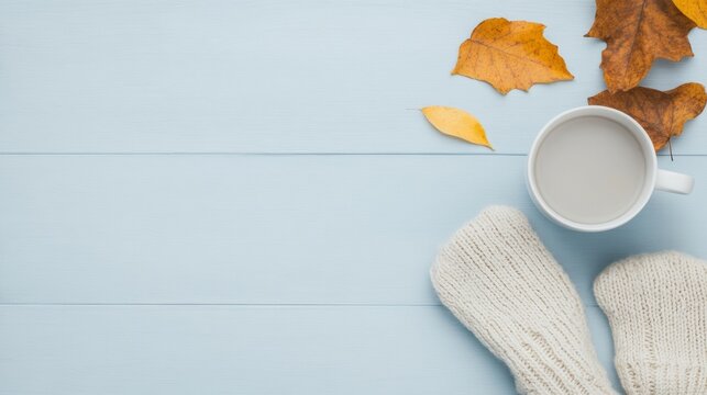 Cozy Winter Flat Lay Wool Gloves, Warm Mug, Autumn Leaves on Weathered Wood Background for Seasonal Comfort