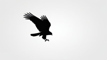 Obraz premium Artistic silhouette of a bird flying, with dynamic wings and a sharp beak.