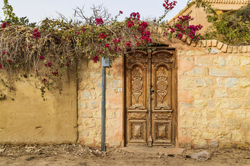 Faiyum, Egypt. Wooden door in a wall.