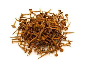 Rusty cut shaped carpentry nails on white