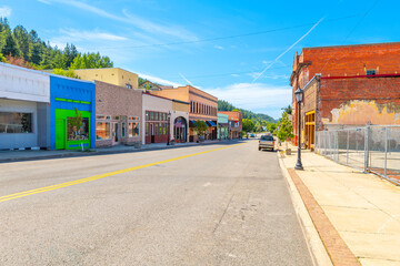 Naklejka premium McKinley Avenue, the main street through historic Kellogg Idaho in the Silver Valley district. Once a booming mining town, now a popular ski resort, August 19 2024. 