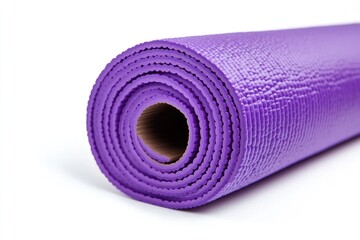 A purple yoga mat rolled up on a white surface, perfect for storing or traveling with