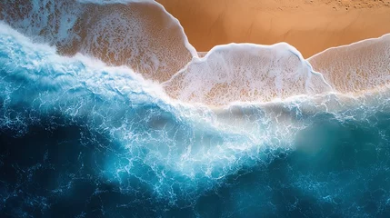 Fotobehang Waves gently lap against a sandy beach under clear skies during the golden hour of sunset © melvilsky