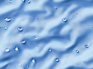 Water drops on blue fabric