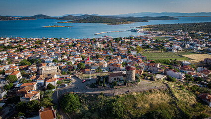 Obraz premium Aerial view of Alibey Island with mill, sea and Turkish flag. Turkey.