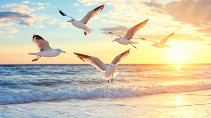 Seagulls flying over the ocean at sunset with vibrant sky colors and gentle waves