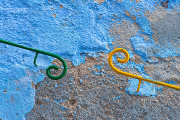 Africa, Morocco, Chefchaouen. Iron railings on wall.