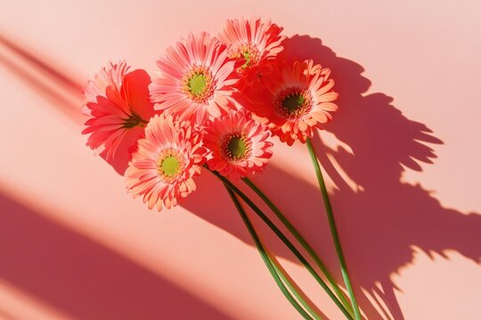 A bunch of pink flowers placed on a table, ideal for decoration or photography props