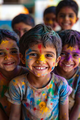 Fototapeta premium A group of children covered in colored powder smile at the camera
