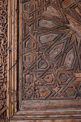 Marrakech, Morocco. The Saadian tombs which is the famous royal necropolis from the 16th century. Carved door