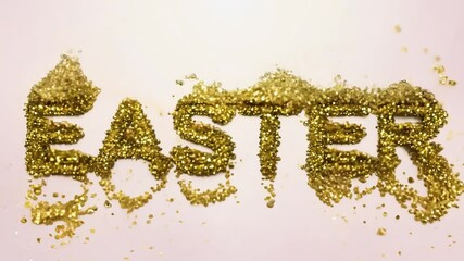 Golden glitter easter text dissolving on pink background