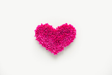 Handmade corrugated paper heart. Pink heart on white background. Valentine's day background. February 14.