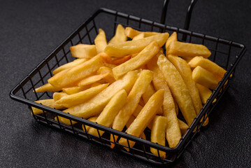 Delicious crispy French fries with salt and spices