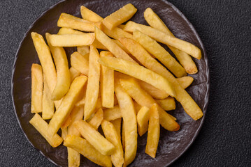 Delicious crispy French fries with salt and spices