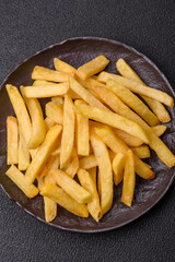 Delicious crispy French fries with salt and spices