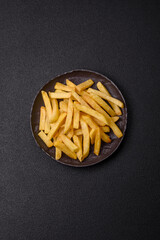 Delicious crispy French fries with salt and spices