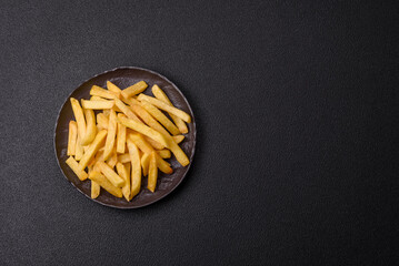 Delicious crispy French fries with salt and spices