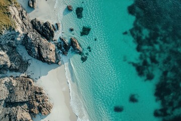Serene shoreline with turquoise waters and rocky formations under clear skies during a sunny day