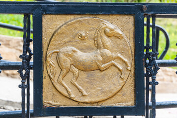 Tunis, Tunisia. A golden horse on a gate.