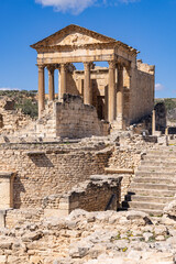 Fototapeta premium Dougga, Beja, Tunisia. The Capitol Temple at the Roman ruins.