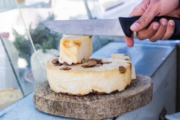 Beja, Tunisia. Cheese with almonds at a shop in Testour.