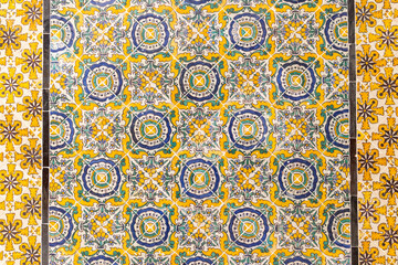 Tunis, Tunisia. Yellow and blue decorative tiles on a house near the Tunis Souk.
