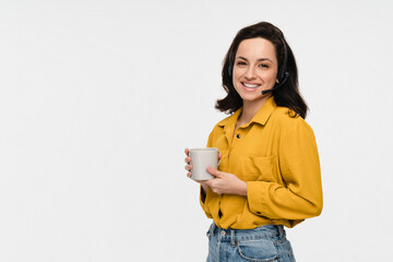 Young business woman telephone operator hotline worker customer support service manager with headset hold cup of coffee isolated on a white background copy space. Call center concept