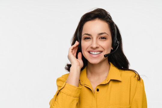 Close up portrait of friendly smiling woman female consultant manager worker of a call canter hot line costumer support in headset isolated on white background. Ready to help