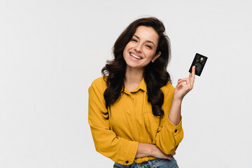 Beautiful young hispanic latin girl woman female student holding showing presenting credit bank...