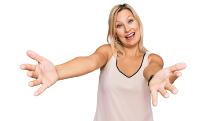 Middle age caucasian woman wearing casual clothes smiling cheerful offering hands giving assistance and acceptance.