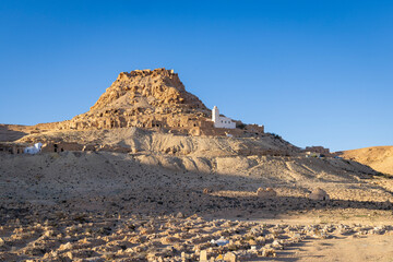 Chenini, Tunisia. Small mosque on a hill above a cemetery near Tataouine.