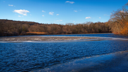 Lake with frozen ice and snow, a New England Winter Landscape at Sleeping Giant Park in Hamden, Connecticut