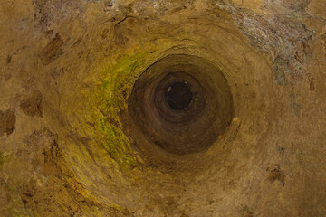 Bottom view of an air duct shaft in the ancient underground city of Ouyi, Nushabad, Iran. The city was built in the 3rd-7th centuries