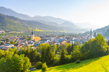 A breathtaking sunrise illuminates the town of Schladming in the Low Tauern mountains. The soft...