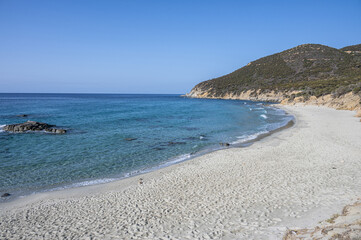 The beautiful beach of Porto Sa Ruxi in Sardinia with white sand and transparent blue and turquoise water