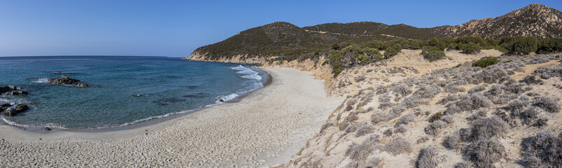 The beautiful beach of Porto Sa Ruxi in Sardinia with white sand and transparent blue and turquoise water