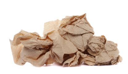Natural brown paper towel scrap, non-toxic and no dyes, crumpled and wrinkled ball isolated on white