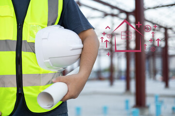 Safety workwear concept. Male hand holding white safety helmet or hard hat. Construction worker man