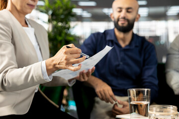 Company CEO attends meeting to discuss about new business vision with executive board presenting him business growth ideas. Close up of employee pitching investment strategy to manager