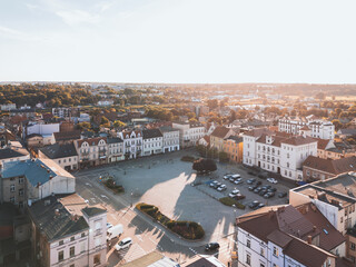 Summer aerial skyline cityscape of Town Square and Town Hall in Śrem (Rynek Miejski i Urząd Miejski w Śremie). Wielkopolska, Poland at sunset