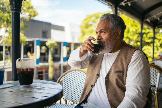 Senior man waiting for his food in a pub