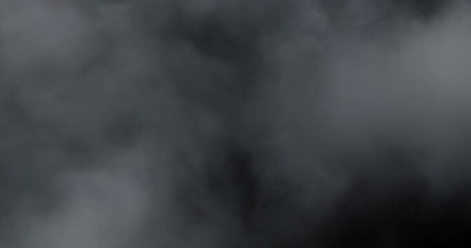 4K VFX Element practical atmospheric smoke. Abstract dense haze mist smoke cloud. Smoke in slow motion, floating through space against black. Mist effect. Fog effect. Haze and vapour action element.
