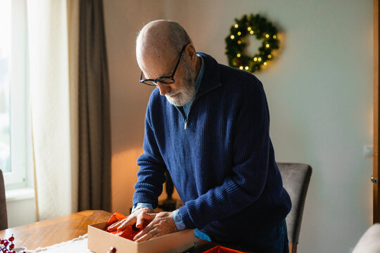 A man unpacks gifts