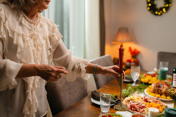 A woman sets the table